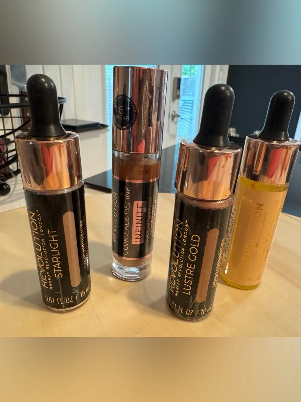 Revolution Concealer, Liquid Highlighters, and Baking Oil. All 4 included. NWT